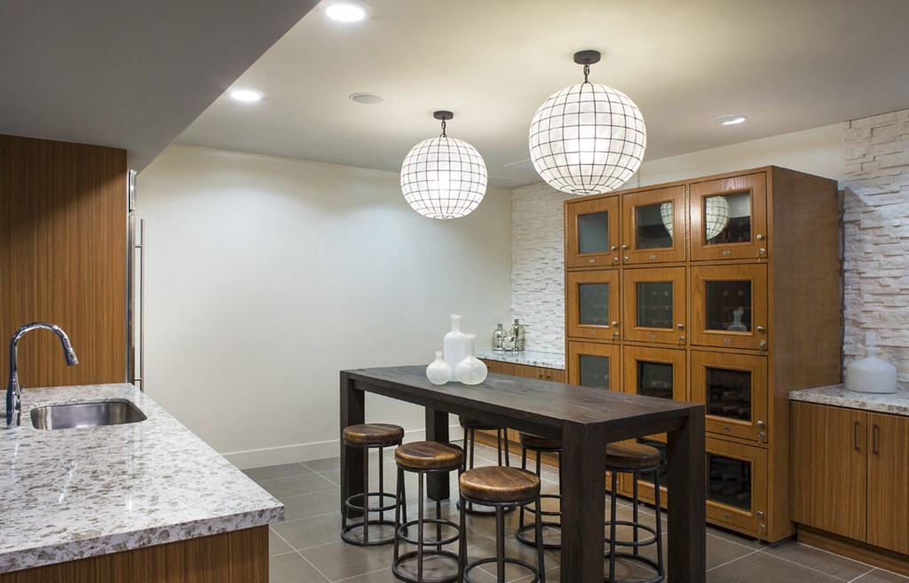 a kitchen with a dining table and a sink