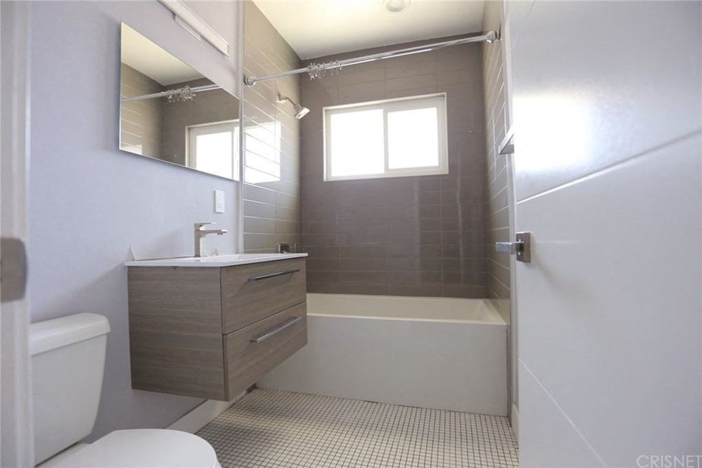 a bathroom with a sink toilet and a shower