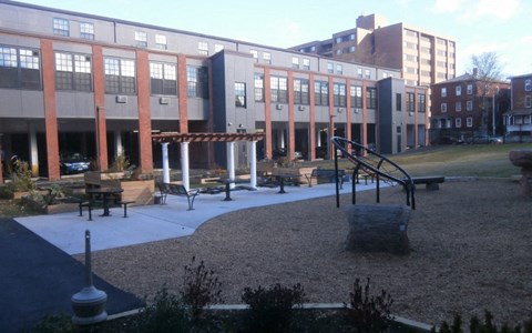 a playground in front of a large building