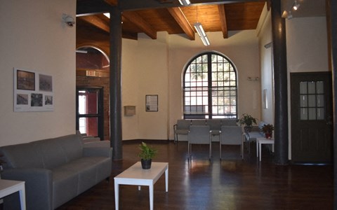 the living room and dining area of a house with a large window