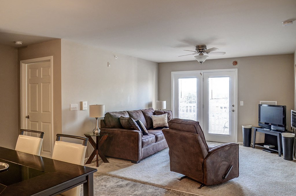 a living room with a couch and a tv
