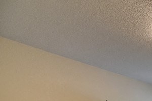 Bedroom with Carpet, Bedside Dresser, Blue Wall, Ceiling Light and Window
