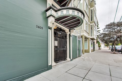 A green building with the number 3605 on it.