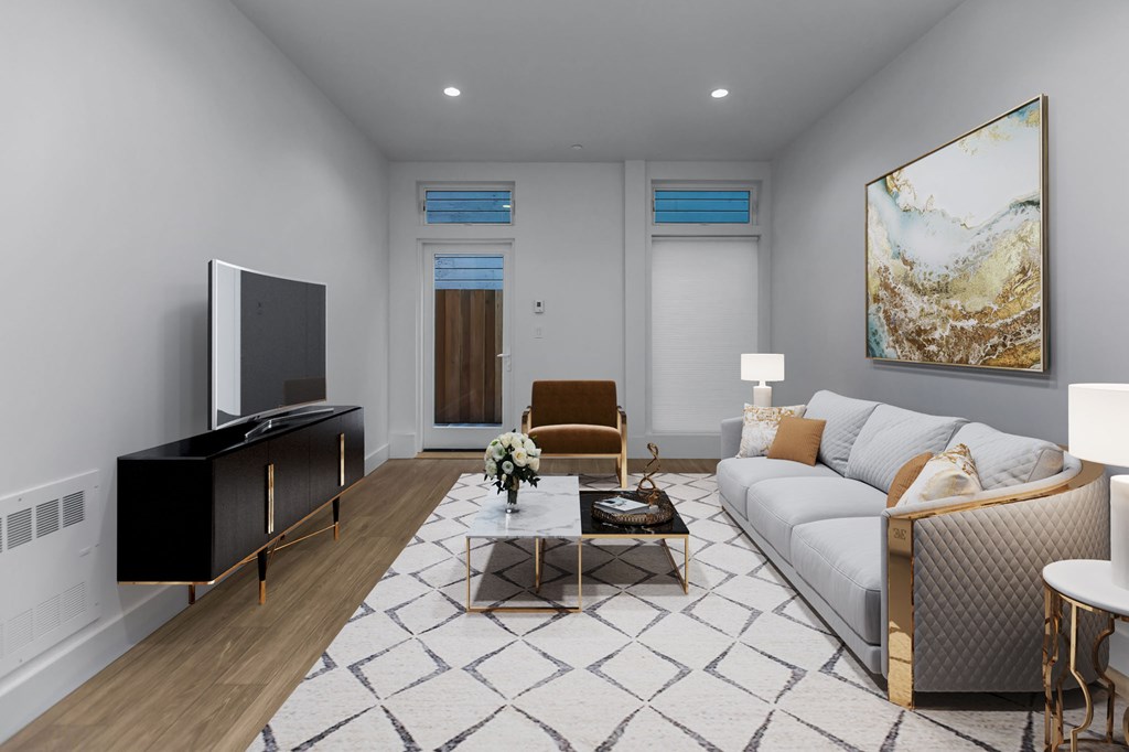 A modern living room with a television, sofas, and a coffee table.