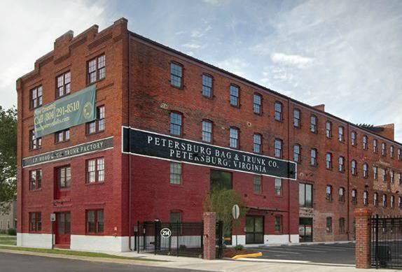 a large brick building with a sign on the side of it