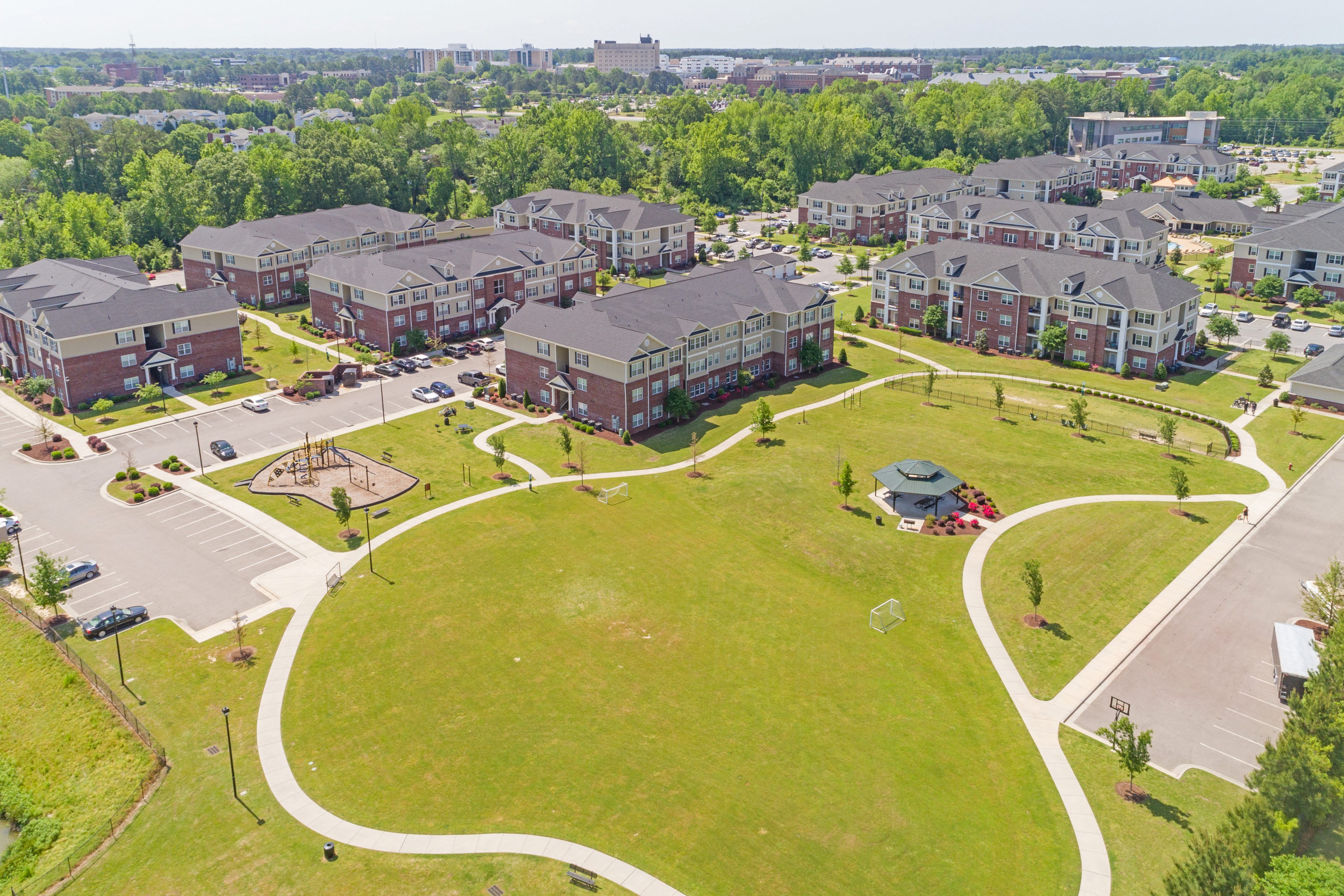 aCommunity Park with Playground, Dog Park, and Walking Trail t The Heritage at Arlington Apartment Homes, Greenville, NC, 27834