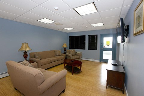 a living room with couches and a table