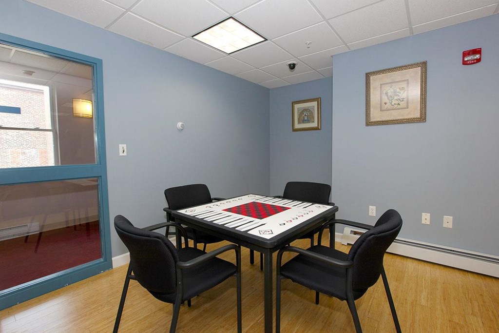 a game room with a table and chairs