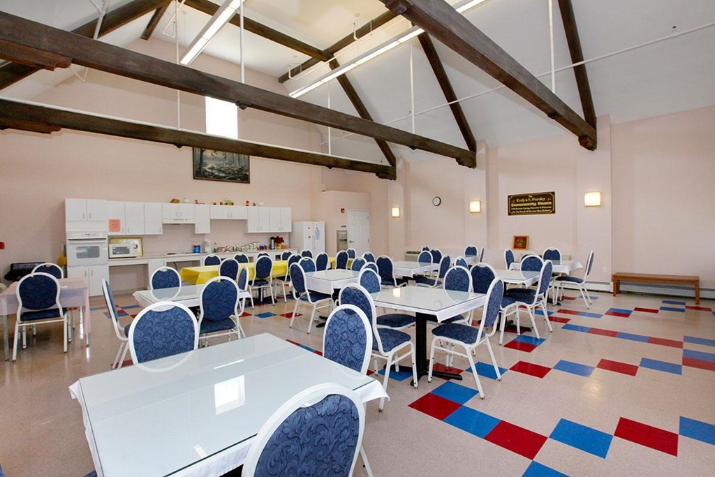 a dining room with tables and chairs
