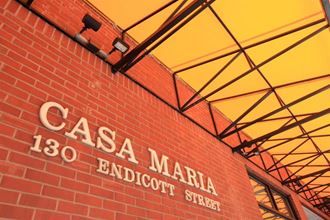 a red brick building with the words casa maria 1820 goddard street