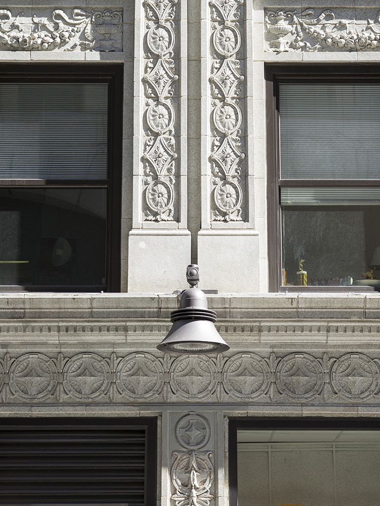 a bell on the side of a building