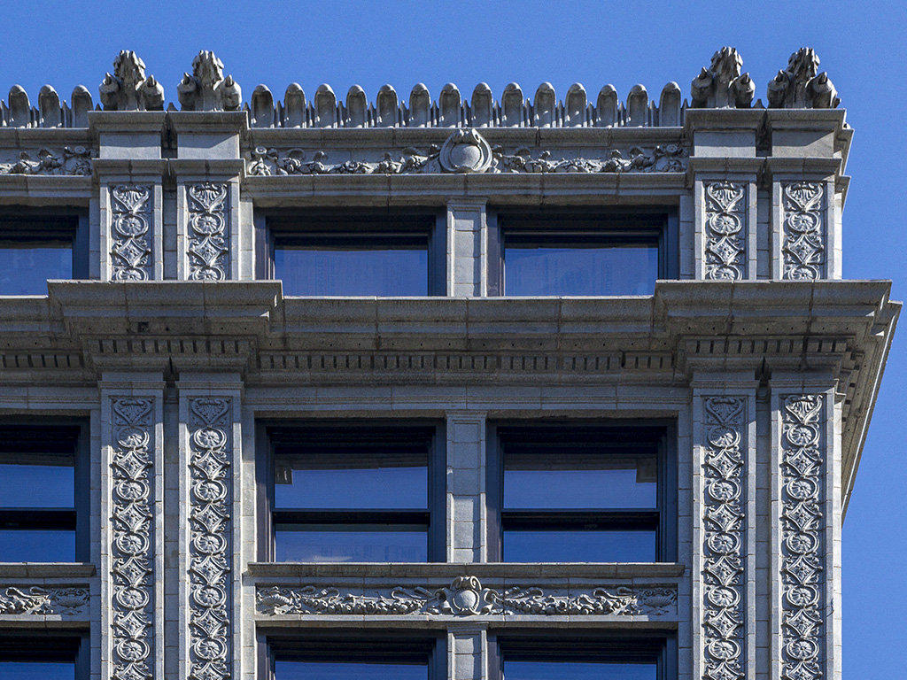 an ornate building with a blue sky in the background