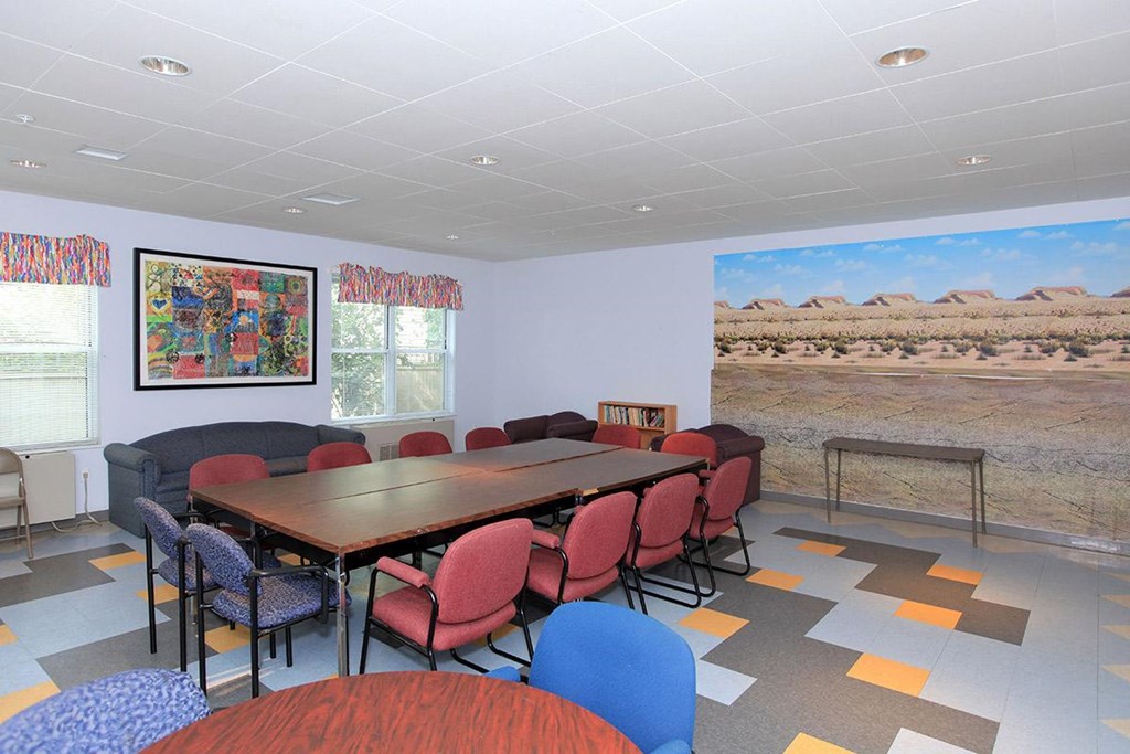 a conference room with a large table and chairs