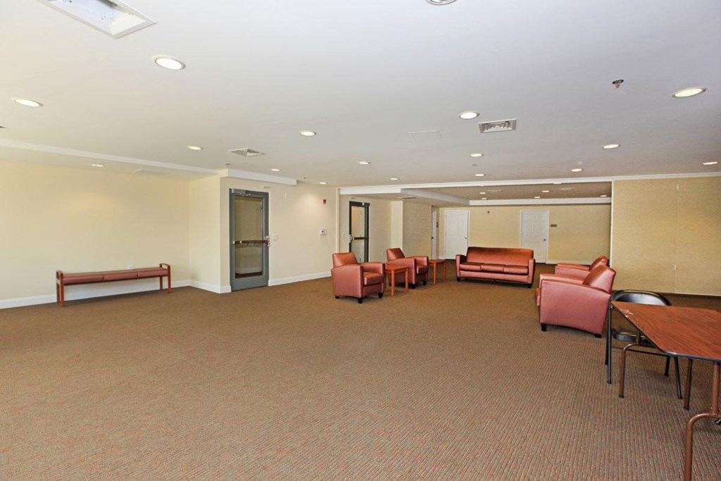 a large room with couches and chairs and a table