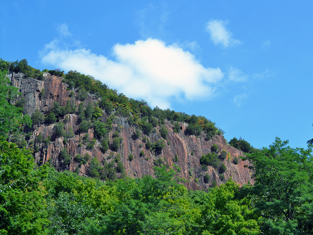 a mountain with a cloud in the sky