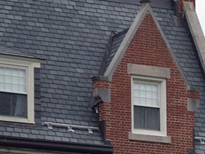 a red brick building with an flag in front of it