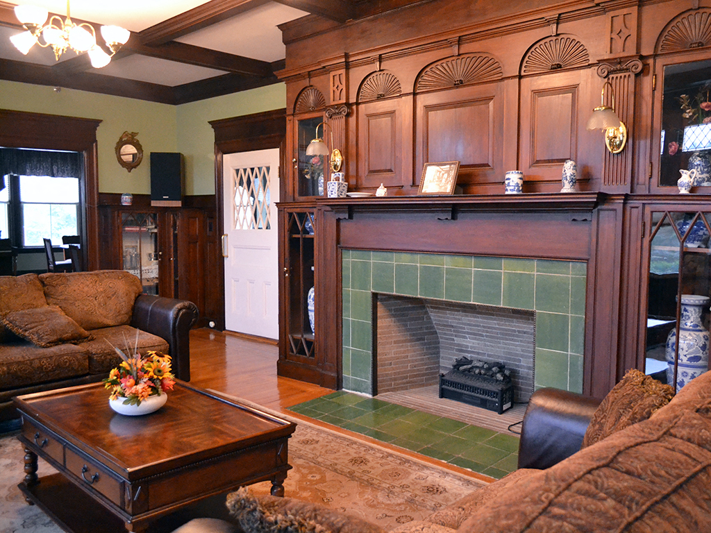 a living room with a fireplace and a coffee table