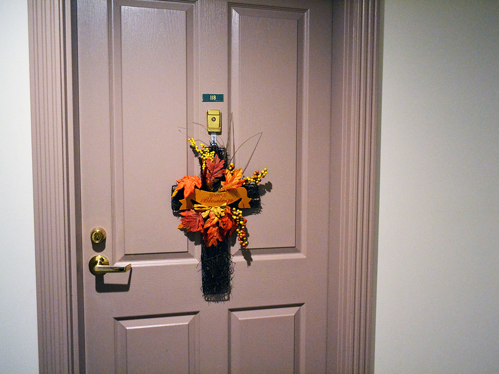 a vase of flowers on the door of a door