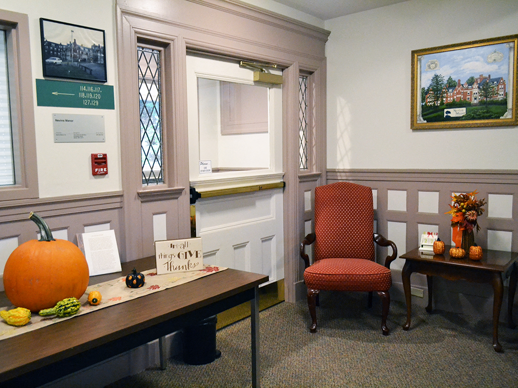 a halloween display in an office with a pumpkin on the desk