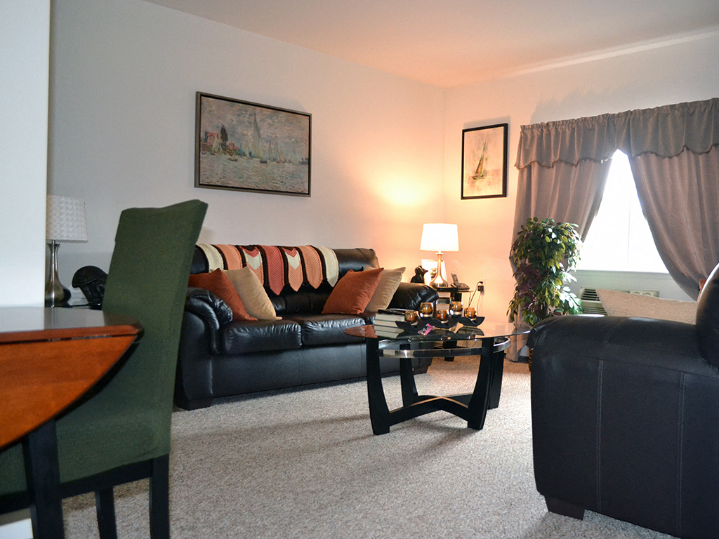 a living room with a couch and a table