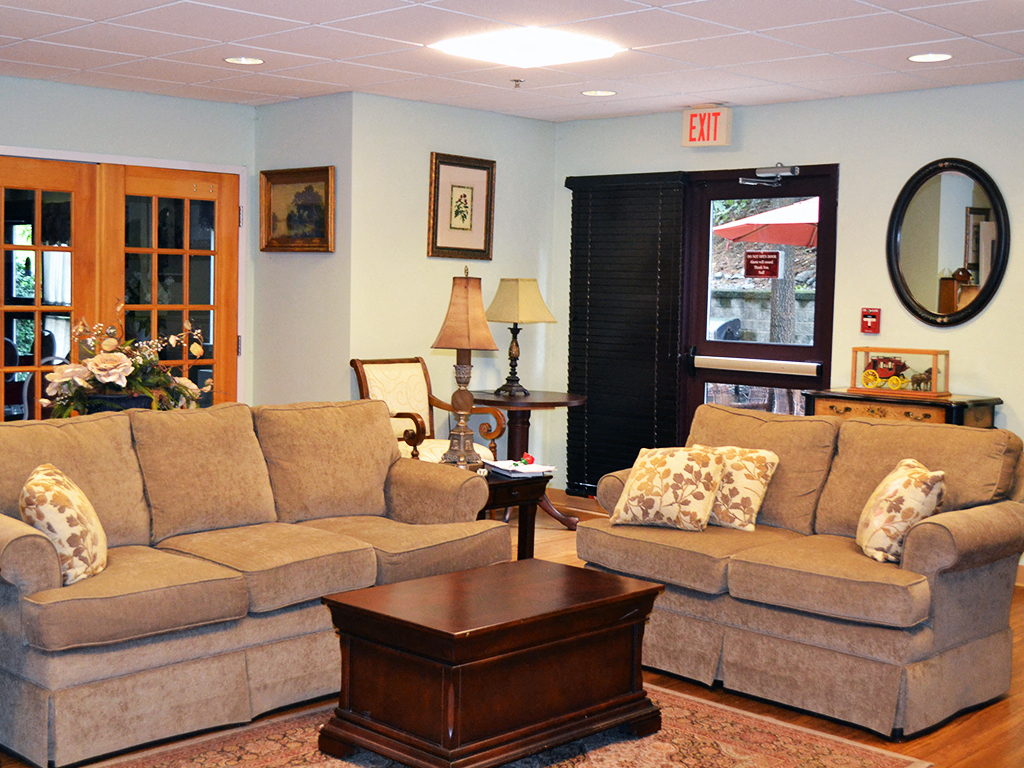 a living room with couches and a coffee table