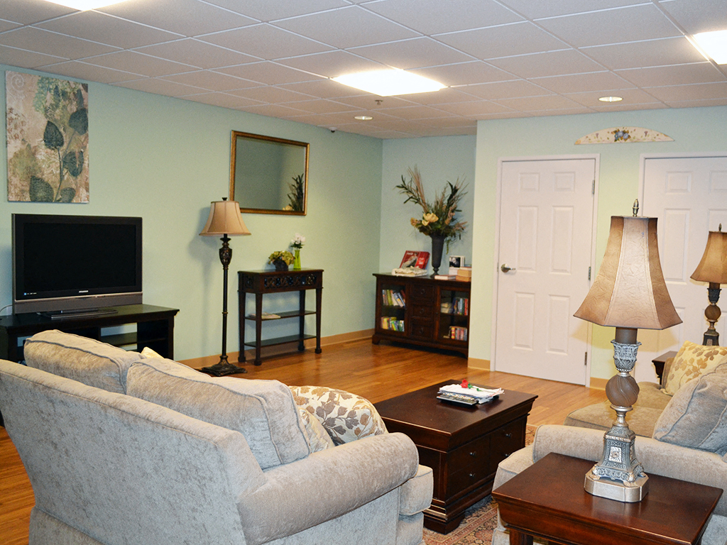 a living room with a couch and a tv