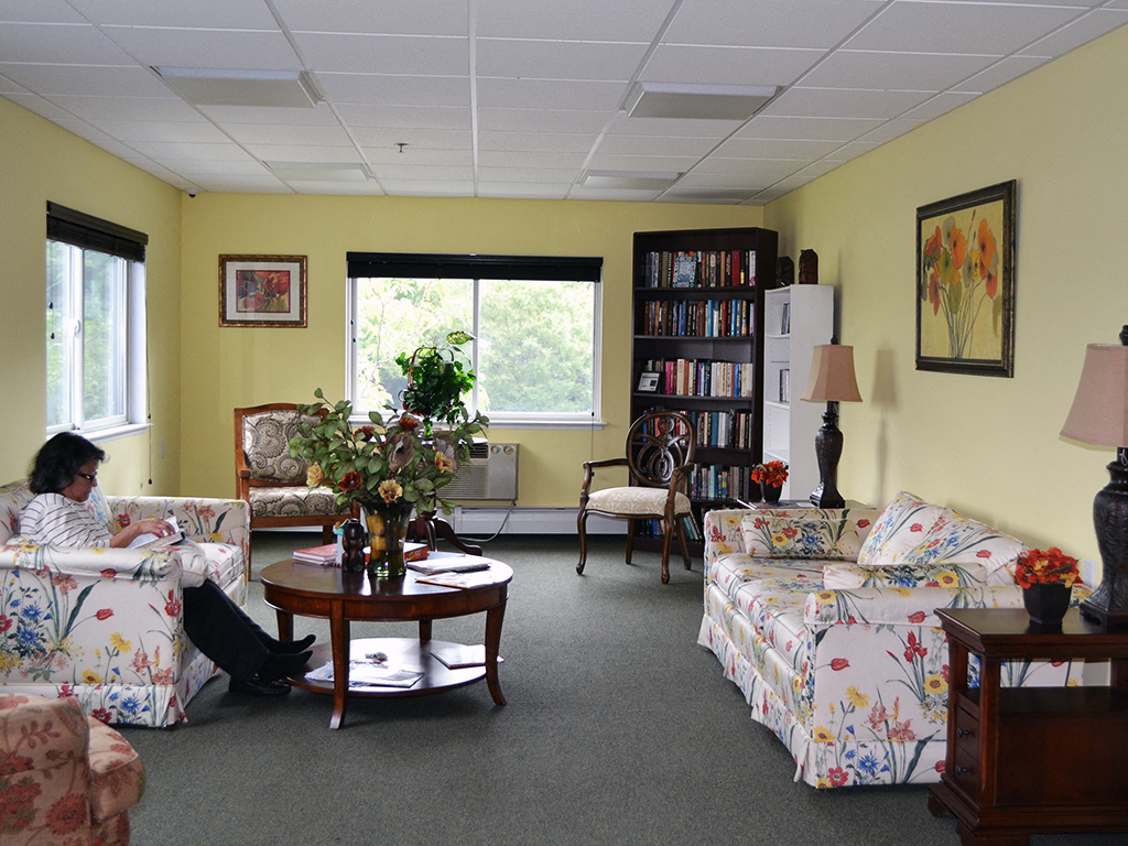 a woman sitting on a couch in a living room