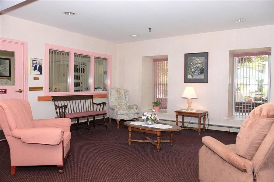 a living room with couches and chairs and a table