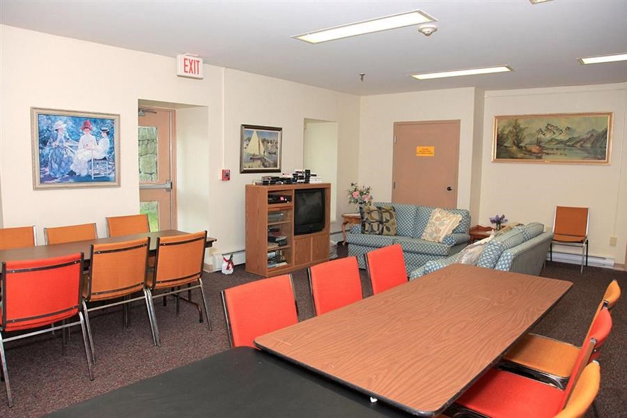 a conference room with a table and chairs