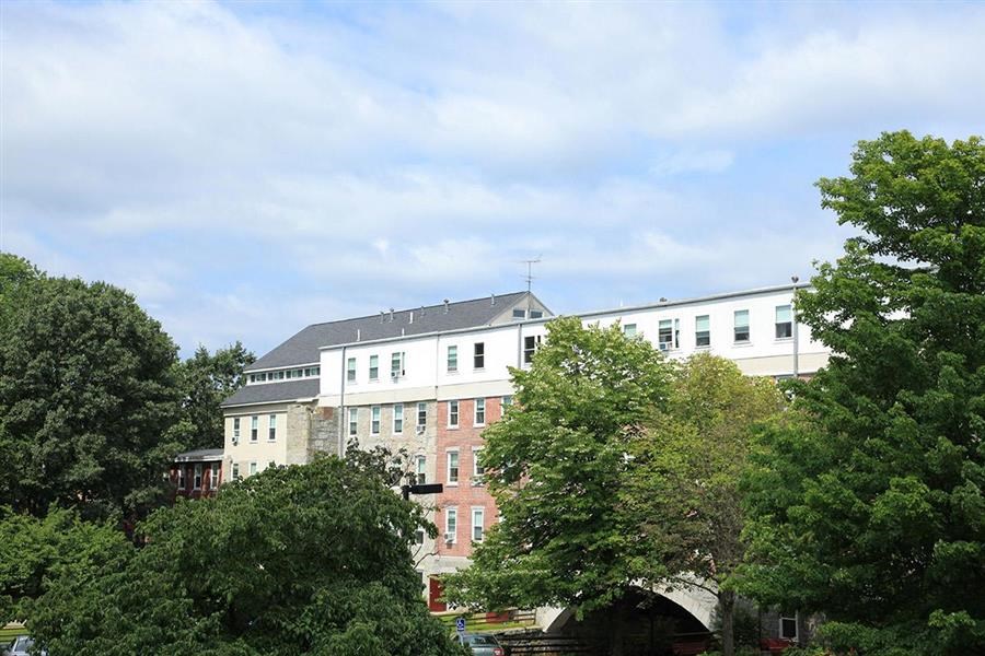 a large building with trees in front of it