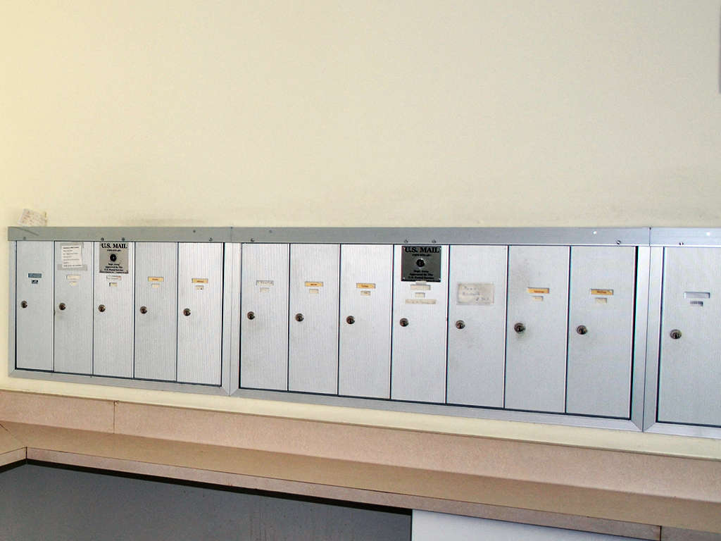 a row of white lockers on a shelf