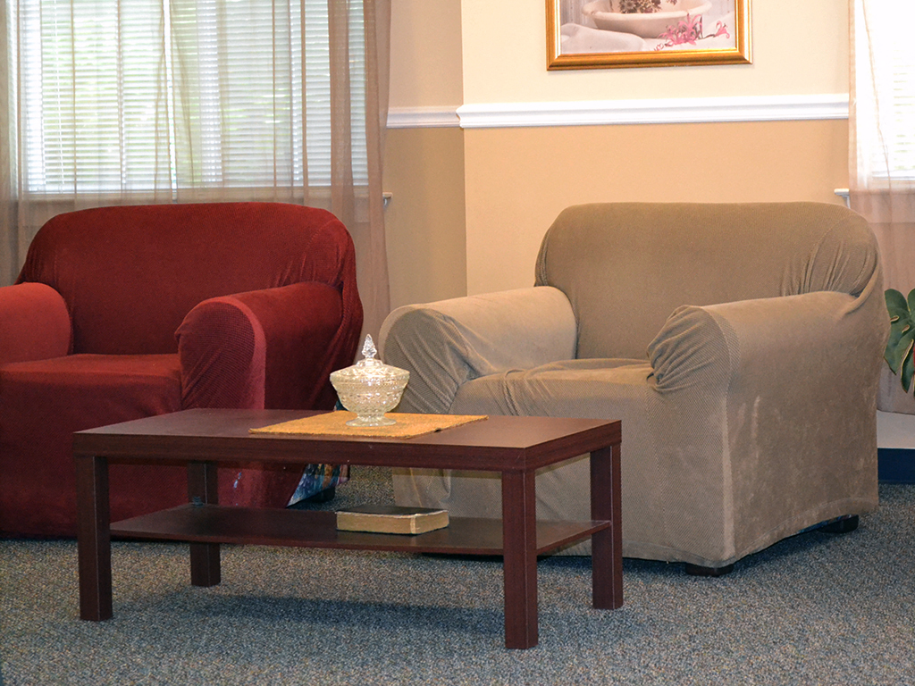 a living room with two chairs and a coffee table