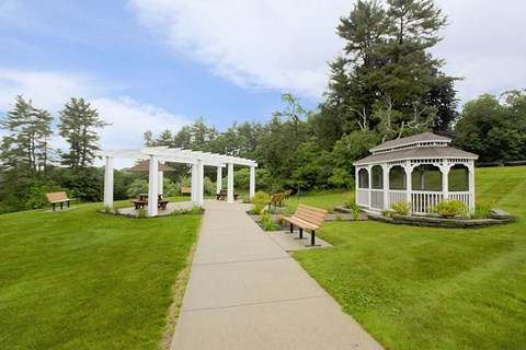 the walkway to the gazebo and benches in the park