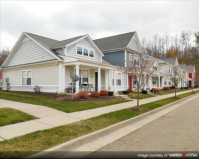 a row of houses on the side of a street