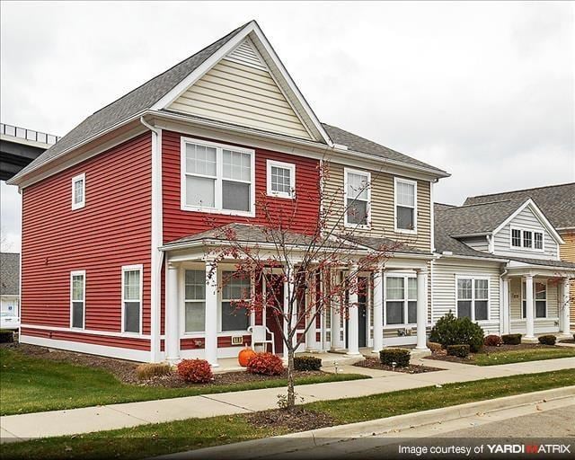 a red house on the side of a street