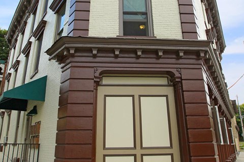 the front door of an apartment building on a city street