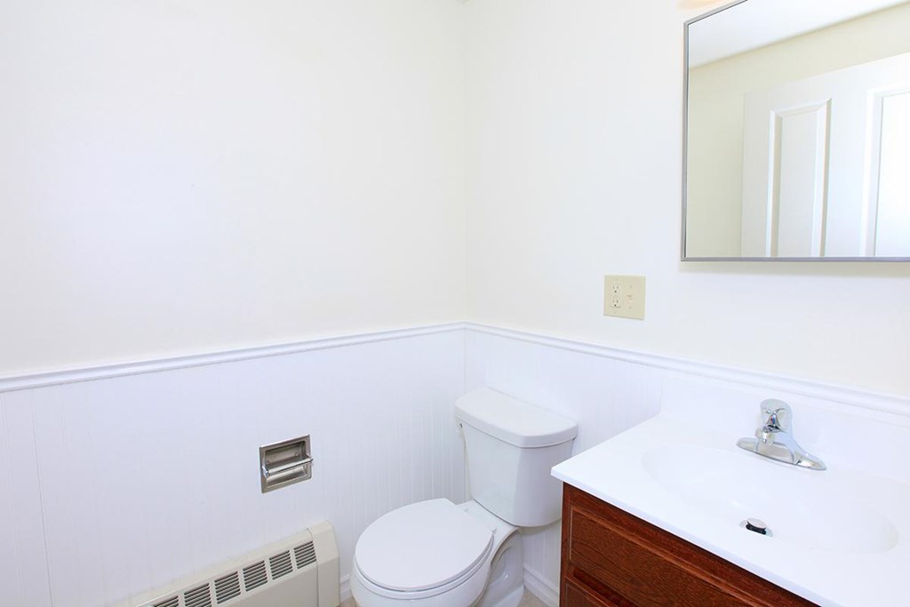a bathroom with a toilet and a sink