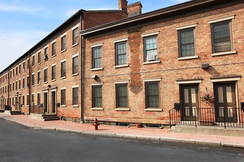 a large brick building on the side of a street