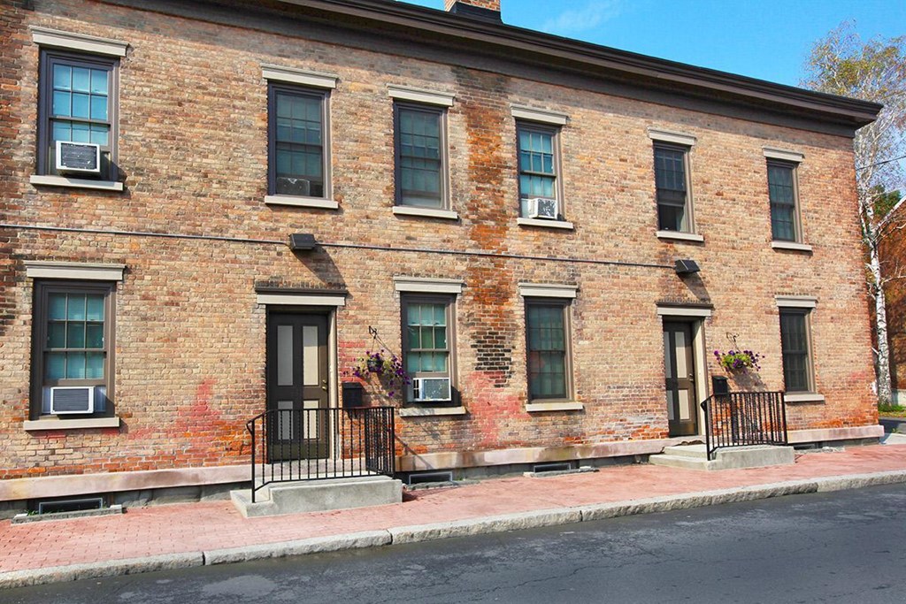 a brick building on the side of a street