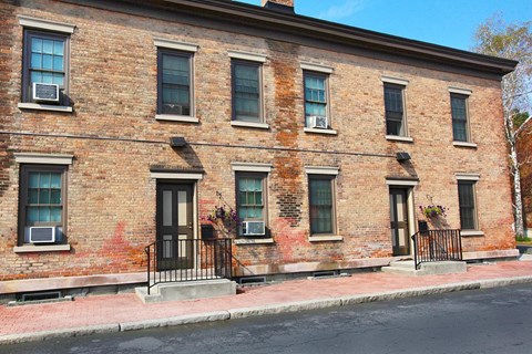 a brick building on the side of a street