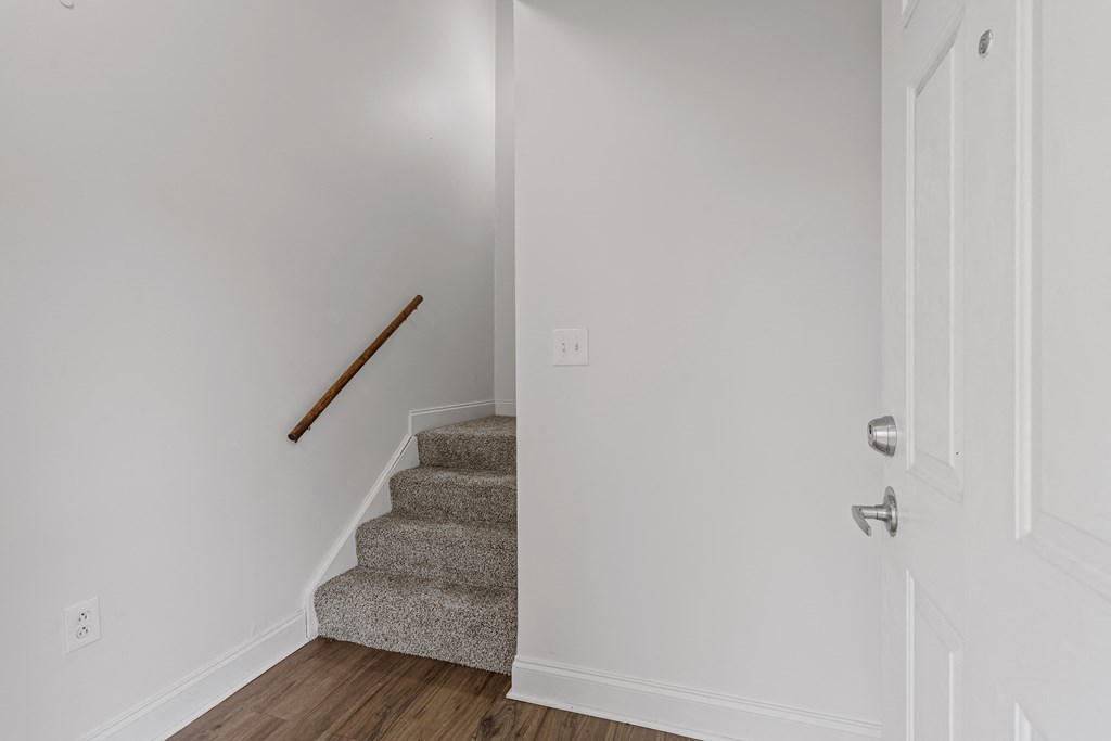 a view from the bottom of the stairs in a 555 waverly unit