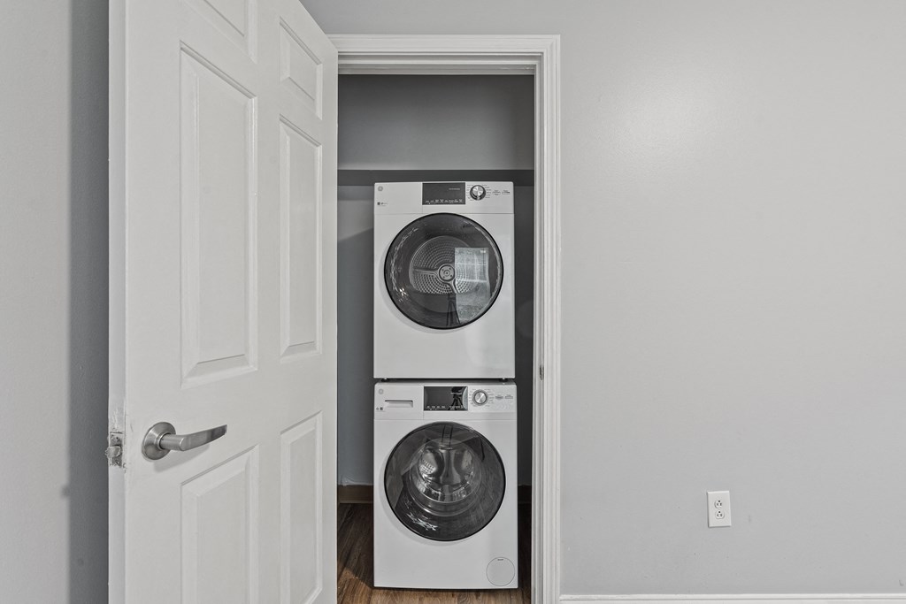 a small laundry room with a washer and dryer