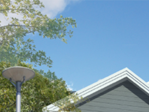 a 3d rendering of a gray house with white windows
