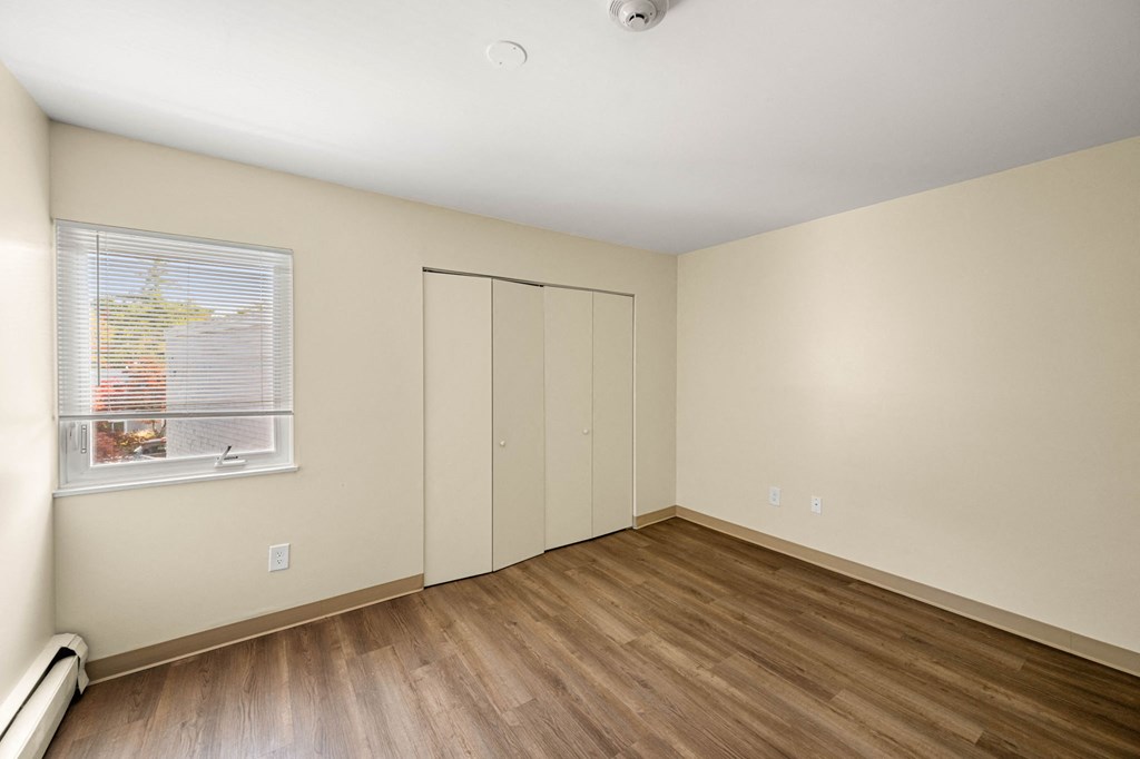 the preserve at ballantyne commons apartment living room with wood flooring and closet
