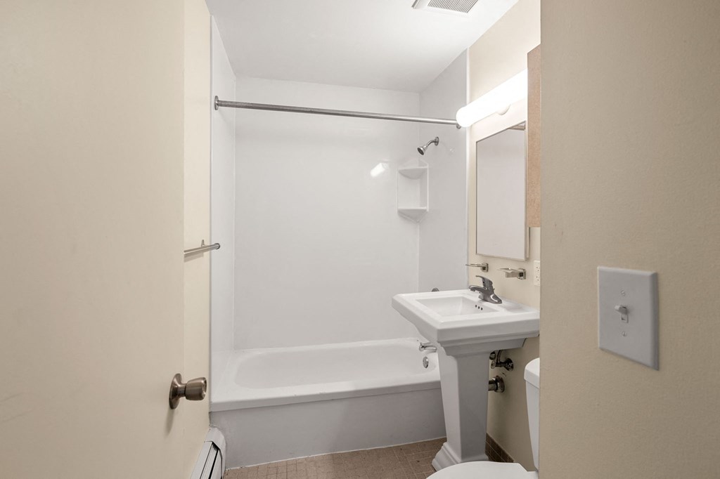 a bathroom with a sink and a bath tub