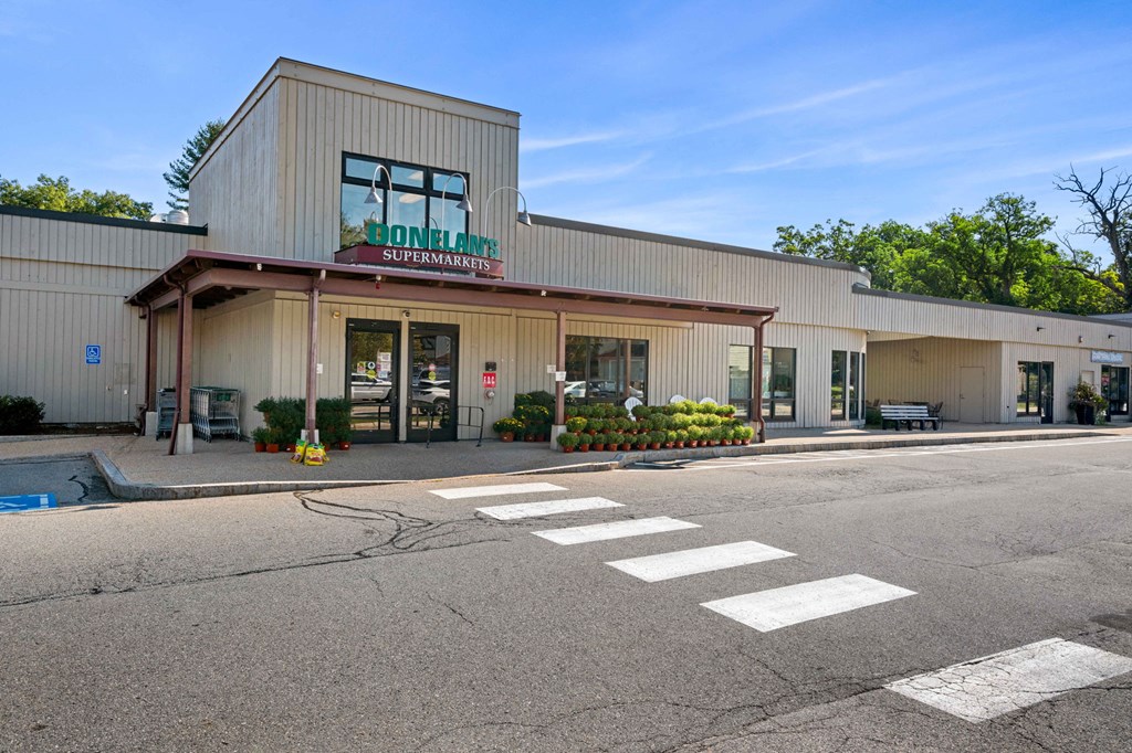 the front of a building with a street in front of it