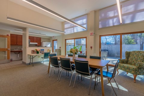 a dining room with a table and chairs