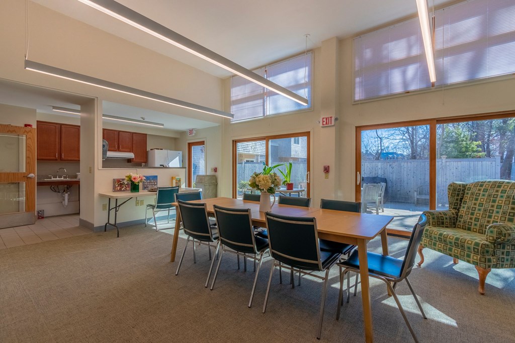 a dining room with a table and chairs