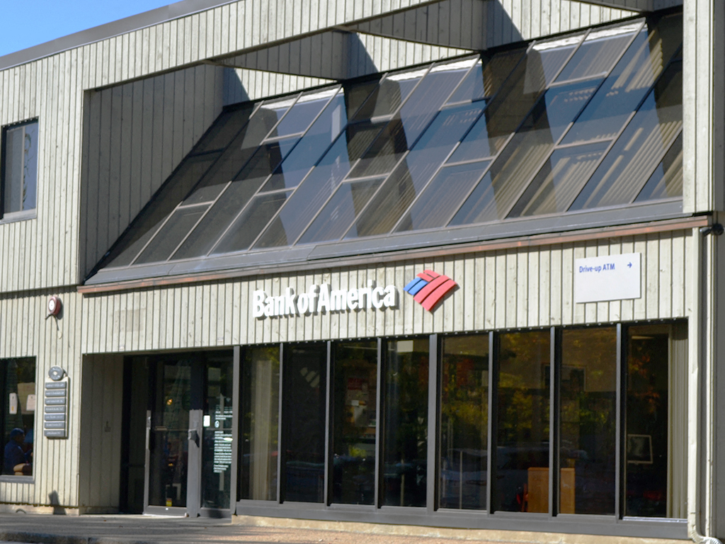 the front of a building with a bank of america sign