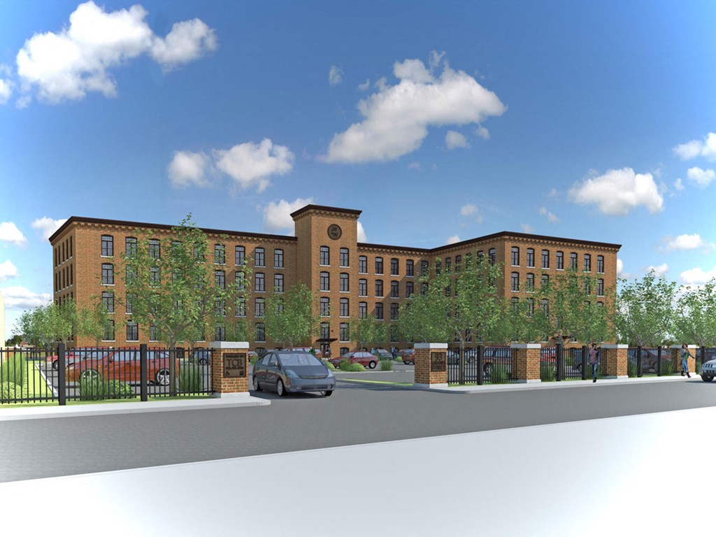 a rendering of a large brick building with a parking lot